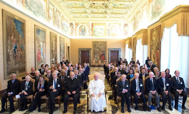 Pope Francis poses during an audience with participants attending a plenary session of the Pontifical Academy of Sciences at the Vatican. CNS photo: L'Osservatore Romano. Meeting of the Pontifical Academy of Sciences